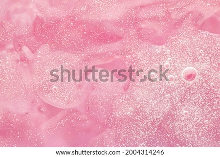 Abstract pink liquid background, paint splash, swirl pattern and water drops, beauty gel and cosmetic texture, contemporary magic art and science as luxury flatlay design.