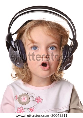 Child wearing headphone and listening the music