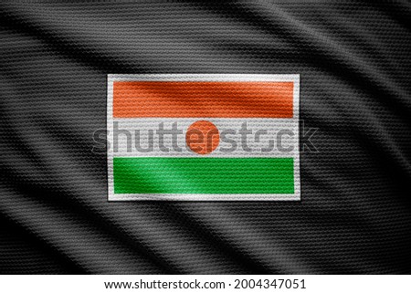 Niger flag isolated on black jersey. National symbols of Niger.