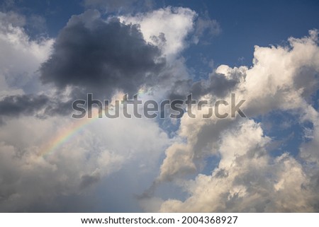 Rainbow in the blue sky