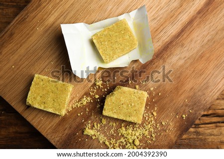 Bouillon cubes on wooden table, top view