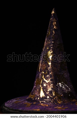 Witch hat on halloween with black background taken close up