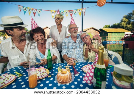 Group of seniors celebrating birthday. Young at heart