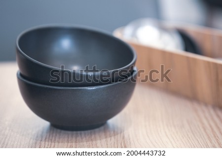 Black bowl of hot soup. Selective focus. hot food concept.
