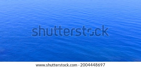 Blue sea water surface. Beautiful blue sea calm background.