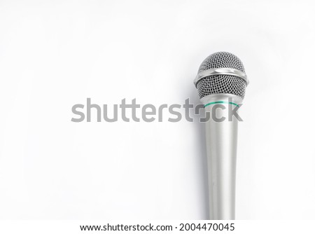 Silver microphone on white background.