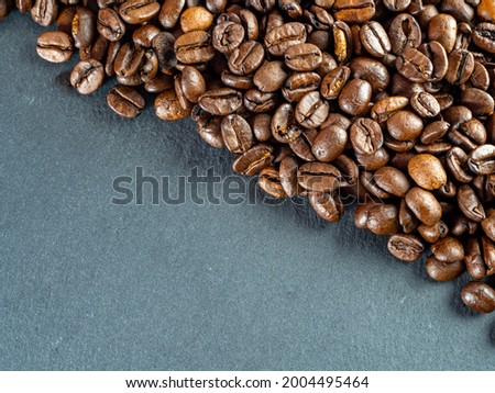 Coffee beans are not black textured background.