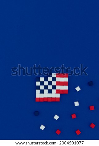 American flag made of magnetic cubes in pixel art style. American independence day concept. Top view, copy space.