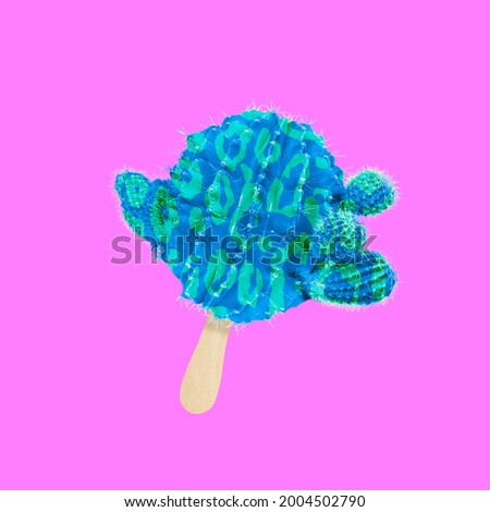 Minimal cactus design. Spiny round colored cactus instead of ice cream on a wooden stick isolated over bright pink background. Creative composition. Copyspace for advertisement