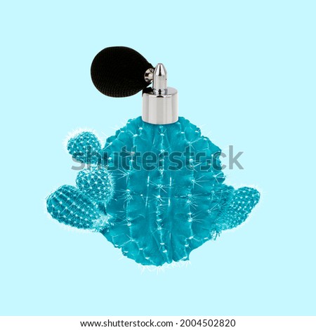 Bottle of perfume in the shape of spiny round blue cactus isolated on light background. Creative composition. Copyspace for advertisement