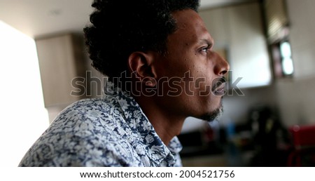 Pensive black African man thinking about solution, person closing eyes pondering life Royalty-Free Stock Photo #2004521756
