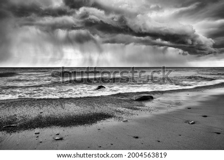 USA, Michigan, Upper Peninsula, Rain cloud over Pictured Rocks National Lakeshore