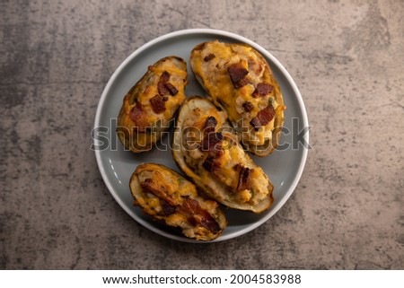 Twice baked potatoes with cheese and bacon Royalty-Free Stock Photo #2004583988