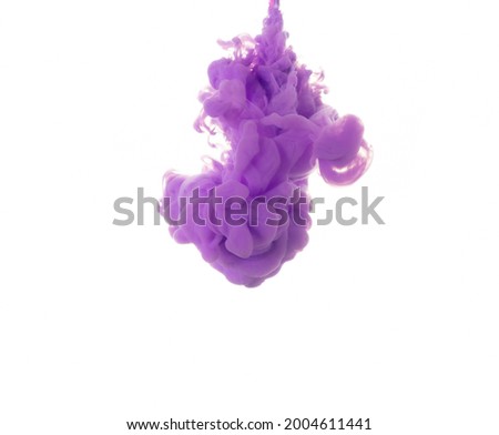 dissolving clouds of purple ink in water on a white background. copy space.