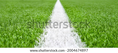 Close up soccer field lines. Background soccer pitch grass football stadium ground view. Stadium field ground grass detail. Ground football field grass macro. Design soccer stadium grass football line Royalty-Free Stock Photo #2004674897
