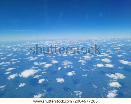 Cloudy skies during aerial photography with blue skys