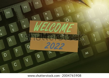 Hand writing sign Welcome 2022. Word Written on New Year Celebration Motivation to Start Cheers Congratulations Retyping Old Worksheet Data, Abstract Typing Online Reservation Lists