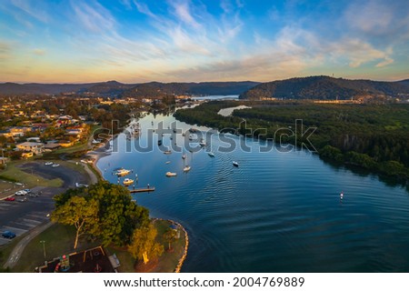 Aerial sunrise waterscape over Brisbane Waters in Woy Woy on the Central Coast, NSW, Australia. Royalty-Free Stock Photo #2004769889