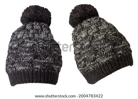 set of two knitted black gray hat isolated on white background.hat with pompon .