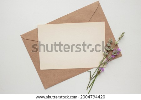 card mockup with lavender and envelope. invitation in minimalist style with flowers