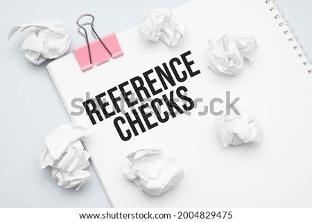 REFERENCE CHECKS. Blank sheet of paper, red paper clip, word Ideas and crumpled paper wads