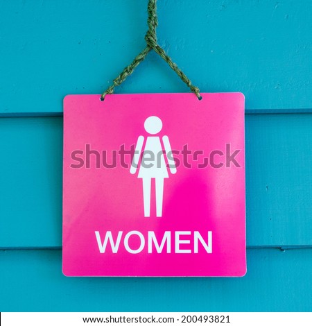 Women toilet label, pink label on wood board