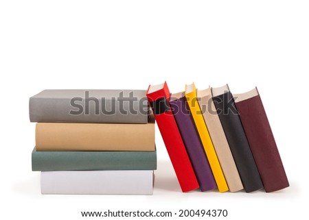 Several colored books in a row and a staple.