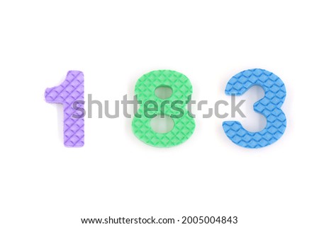 number 183 isolated on white background. Colorful letters on background close up. Alphabet toy. Number one hundred and eighty three.