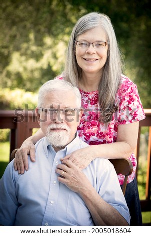 A loving couple and parents posing for a picture