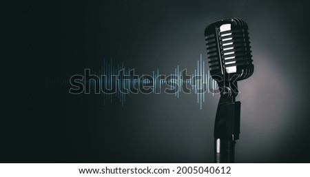 Retro microphone on dark background Royalty-Free Stock Photo #2005040612