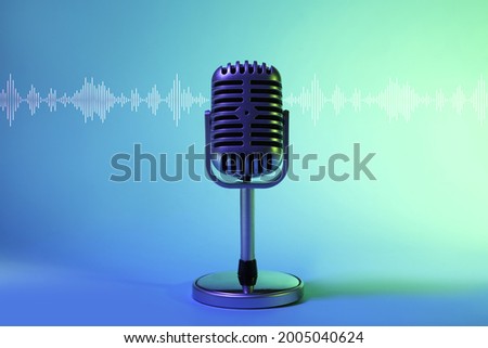 Retro microphone on color background Royalty-Free Stock Photo #2005040624