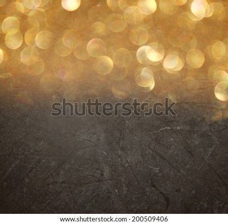 abstract bokeh lights over blackboard textured background