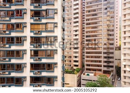 Close-up to a densely populated apartment buildings in Hong Kong.