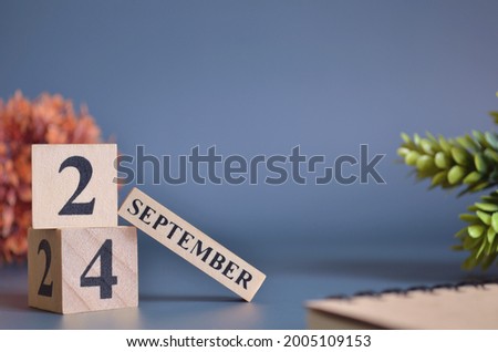 September 24, Cover in the evening time, Date Design with number cube for a background.