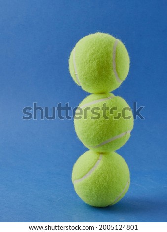 Tennis ball isolated on a blue background        