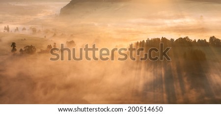 View of a beautiful misty sunrise, panoramic picture.