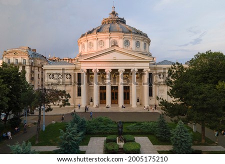 Aerial drone view of The Romanian Athenaeum George Enescu (Ateneul Roman) in Bucharest, Romania. Most prestigious concert hall and one of the most beautiful buildings in the city in the sunset. Royalty-Free Stock Photo #2005175210