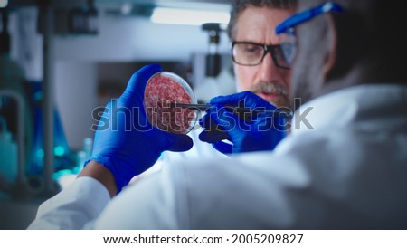 Diverse colleagues discussing lab grown meat Royalty-Free Stock Photo #2005209827