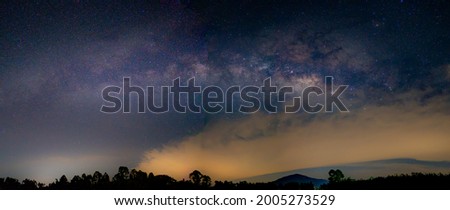 Milky way galaxy on night sky background, blurred clouds over milkiy waw star is beautiful wallpaper, bright star galaxy on night nature abstract of scene over hills or mountain