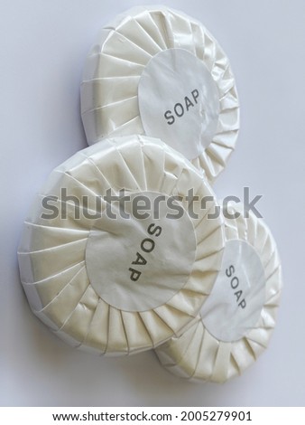 round shape soap with white wrap and white background
