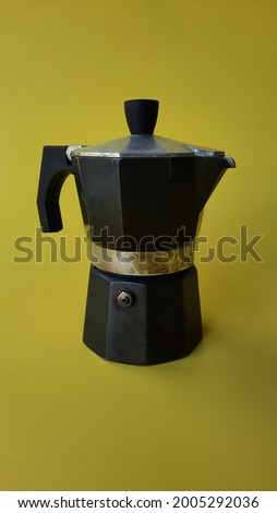 Mocha pot espresso maker on portrait mode yellow background