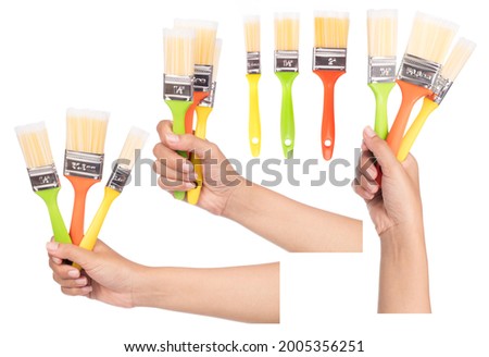 Set of hand holding Paintbrush isolated on white background.