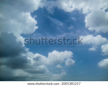Amazing bright blue sky with white and grey clouds. 