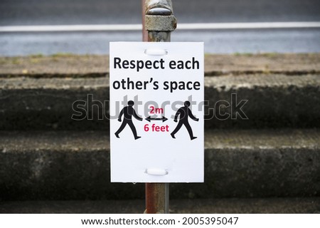 Social distancing sign shop customers to respect and stay safe