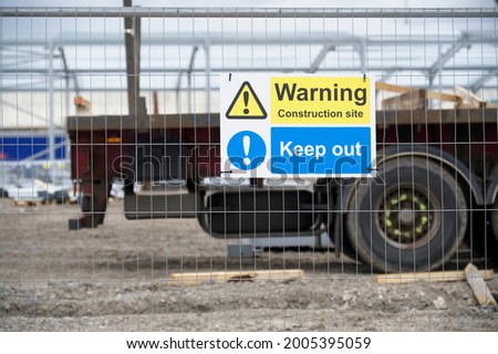 Construction site health and safety message rules sign board signage on fence boundary