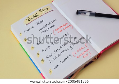 Blog Post writing ideas for beginners handwritten in notebook with pen. Blogging concept, selective focus on the text.