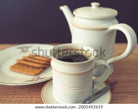 Cup of coffee and cookies on the table, photo