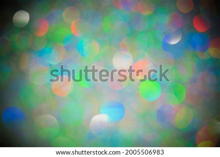 Bright and colorful bokeh background with dark corners
