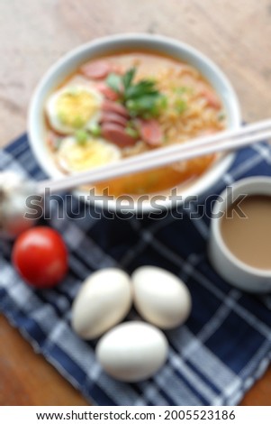 blur photo of noodle soup with hot and spicy sauce