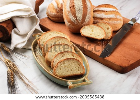 Sliced Toast Loaf White Bread (Shokupan or Mirukuhasu) for Breakfast on Wooden Background, Served with Egg and Milk. Bakery Concept Picture